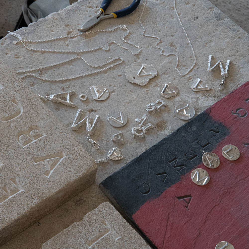 Alphabet Jewellery. The anonymous art of Stone Carving.